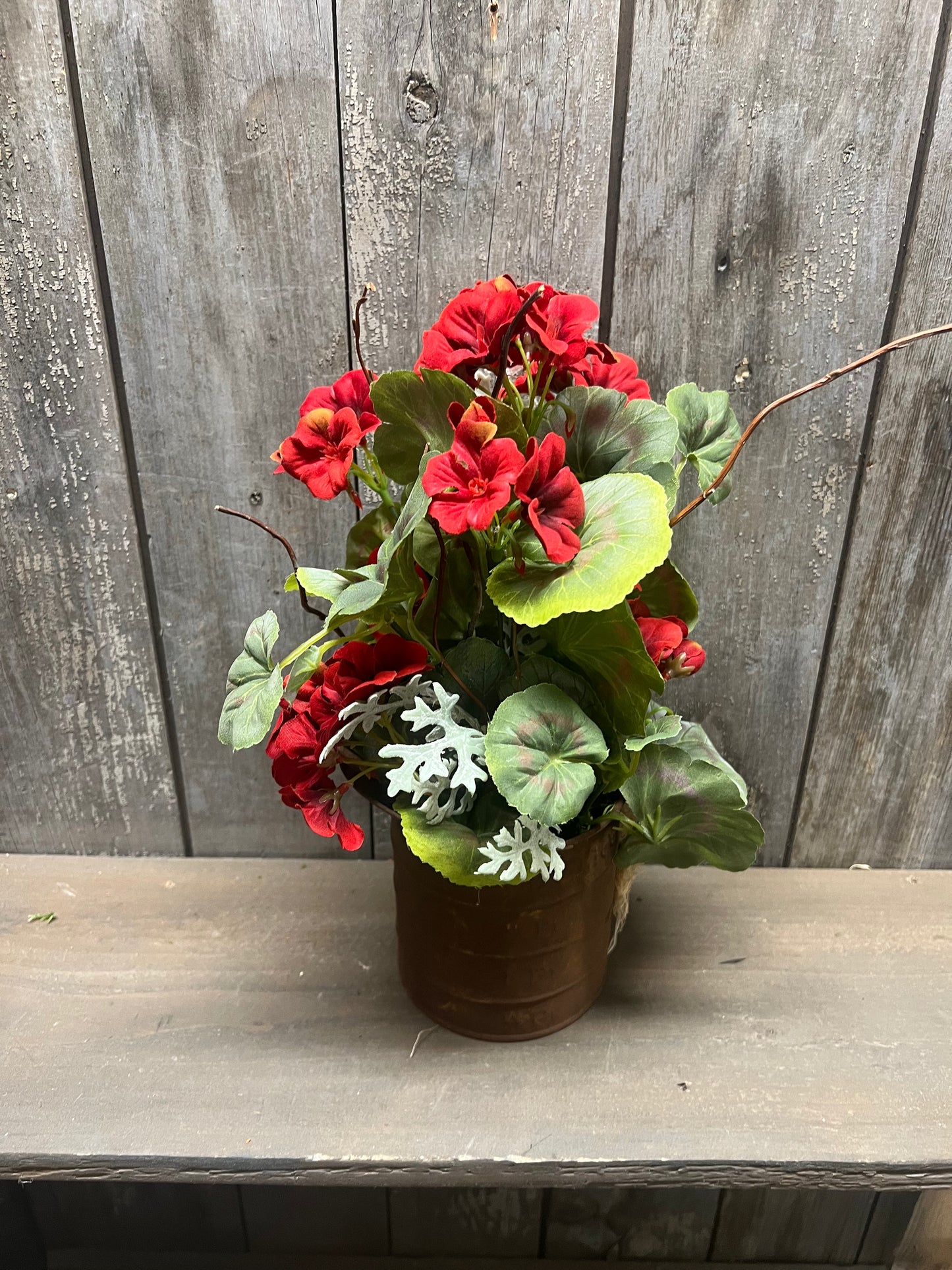 GERANIUMS in Rusty Tin Pitcher